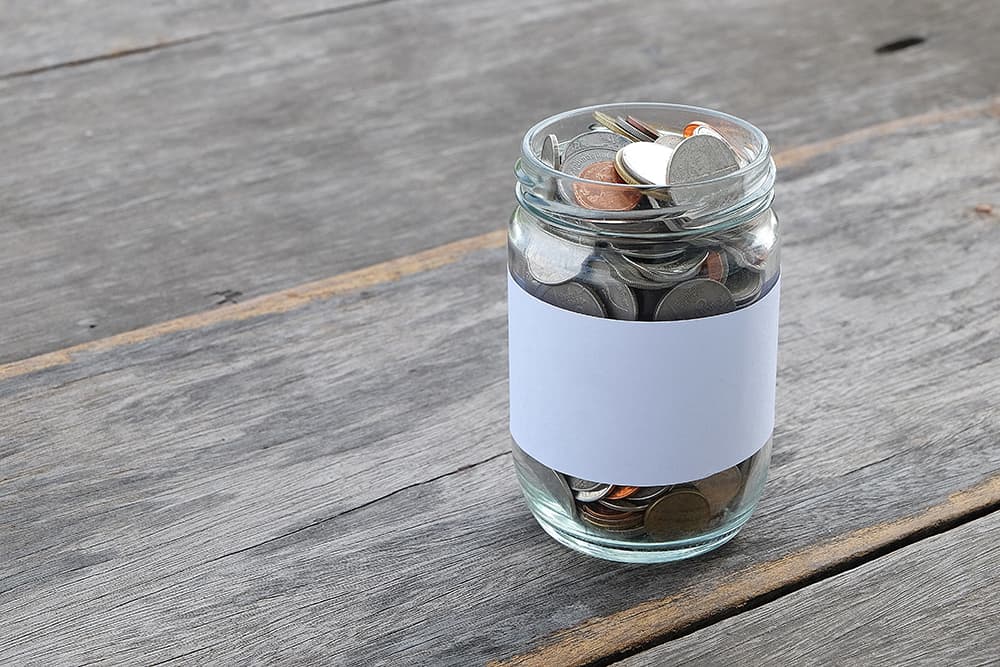 White label payment coins in a jar